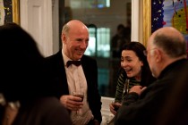 Terry Sandell OBE sharing a joke with two other guests