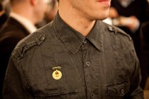 A proud pioneer shows his badge of honour