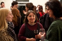 At the post-event reception: a member of the audience talking to Irina Cios and Ramona Mitrica