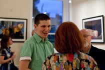 Tudor Prisacariu talking to a member of the audience after the presentation