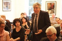 A member of the audience addressing the speakers during the Q&A session