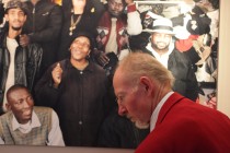 A member of the audience in front of the panel documenting 'The Shops Project' in Sheffield