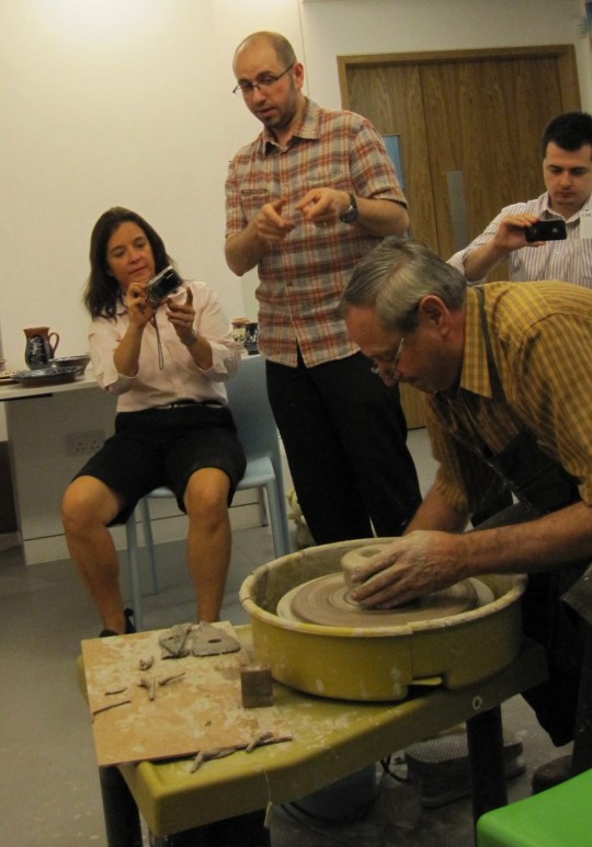 Cornel Sitar demonstrating the traditional work method. Translating from Romanian, Mihai Risnoveanu (Artistic Advisor of the Romanian Cultural Centre). On the right, Adrian Cherciu (Director of Romani-Online.co.uk)