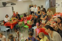 The audience watching the master at work, eager to experiment on the potter's wheel