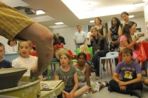A captivated audience watching a master craftsman at work